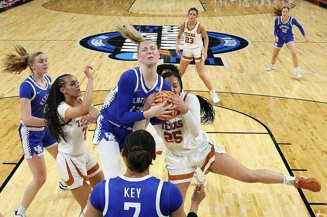 FORT WORTH, TEXAS - MARCH 28: Clara Strack #13 of the Kentucky Wildcats battles Breya Cunningham #25 of the Texas Longhorns for the ball during the second quarter in the Sweet Sixteen of the 2026 NCAA Women's Basketball Tournament at Dickies Arena on March 28, 2026 in Fort Worth, Texas. (Photo by Elsa/Getty Images)