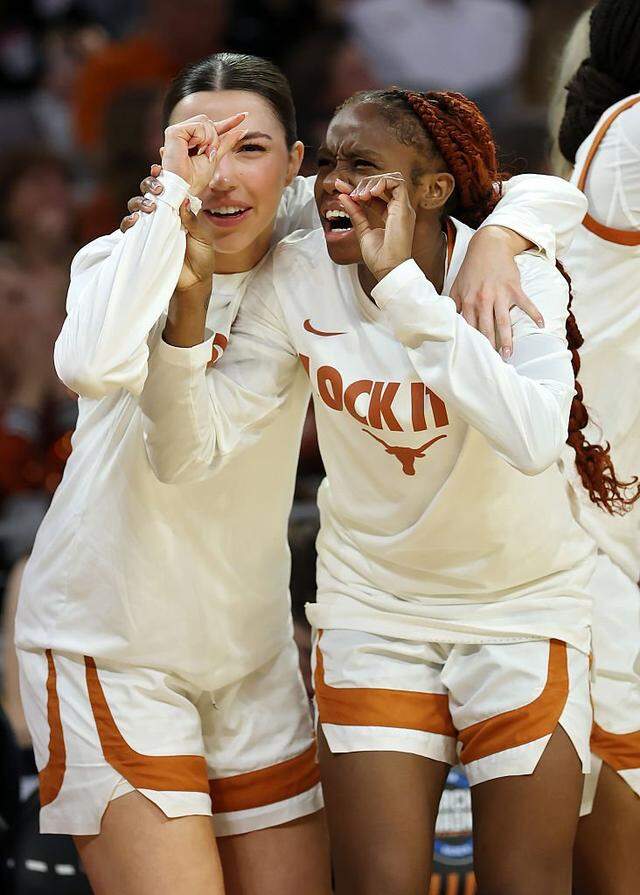 FORT WORTH, TEXAS - MARCH 30: Sarah Graves #6 and Bryanna Preston #1 of the Texas Longhorns celebrate on the bench in the fourth quarter against the Michigan Wolverines in the Elite Eight of the 2026 NCAA Women's Basketball Tournament at Dickies Arena on March 30, 2026 in Fort Worth, Texas. (Photo by Elsa/Getty Images)