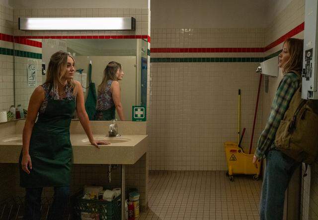 (From left) Amy Matthews (Lainey Wilson) and Kenna Rowan (Maika Monroe) in “Reminders of Him,” directed by Vanessa Caswill.