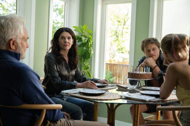 (From left) Patrick Landry (Bradley Whitford), Grace Landry (Lauren Graham), Scotty Landry (Rudy Pankow) and Kenna Rowan (Maika Monroe) in “Reminders of Him,” directed by Vanessa Caswill.