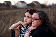 Lindsay Wessinger and her 14-year-old daughter Emma Autry pose for a photo in their Wylie,...