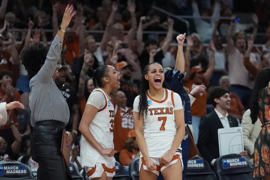 Texas forward Teya Sidberry (32) and guard Jordan Lee (7) celebrate their win over Oregon in the second round of the NCAA college basketball tournament, Sunday, March 22, 2026, in Austin, Texas. (AP Photo/Eric Gay)