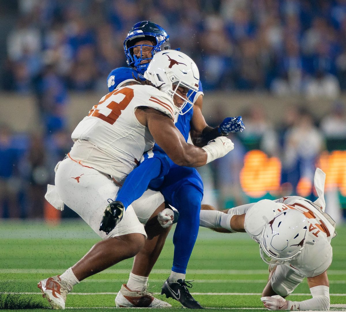 Senior Hero Kanu combines with Michael Taaffe to make the tackle on Wildcat Seth McGowan against Kentucky on Oct. 18, 2025. 