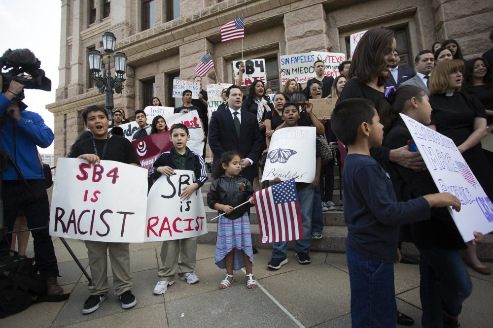 Demonstrators gather at the Capitol to protest Senate Bill 4.