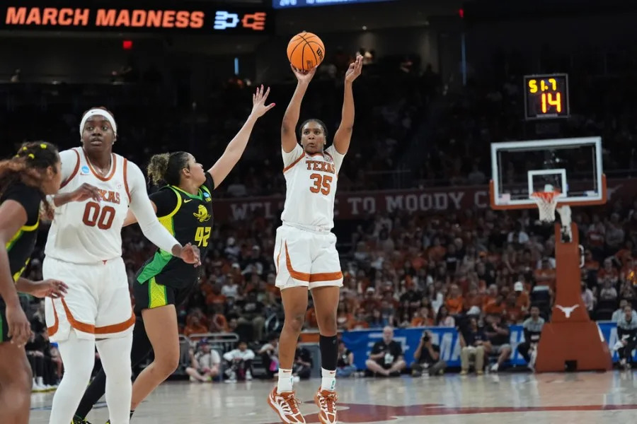 Texas forward Madison Booker (35) shoots over Oregon guard Avary Cain (42) during the second half in the second round of the NCAA college basketball tournament, Sunday, March 22, 2026, in Austin, Texas. (AP Photo/Eric Gay)