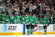 Dallas Stars' Jamie Benn (14), Jason Robertson (21) and Wyatt Johnston (53) celebrate with...