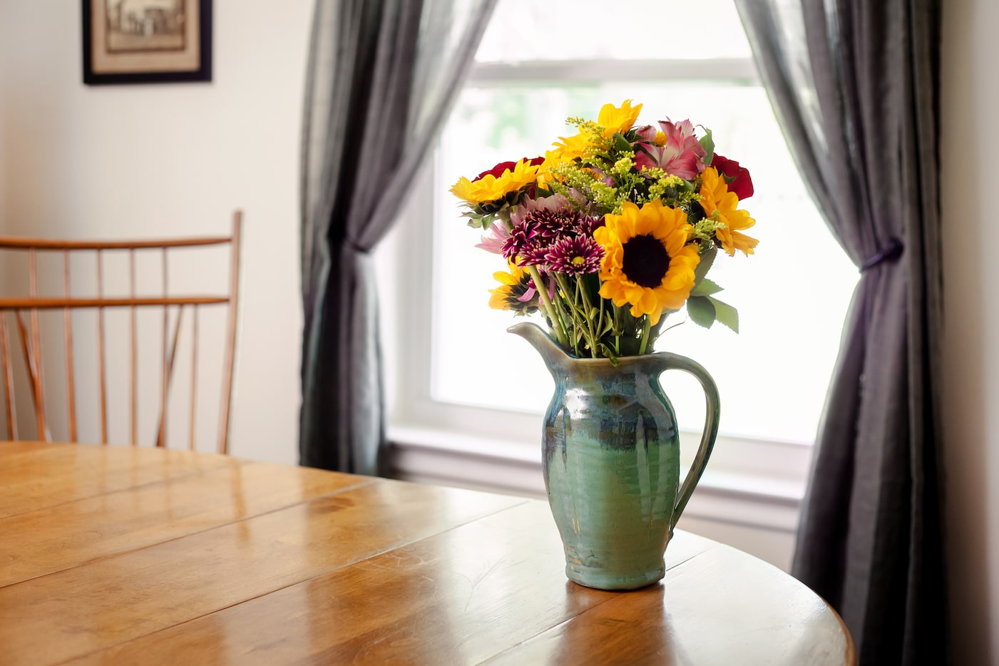 From serving piece to centerpiece: A Holman Pottery pitcher doubles as a vase.
