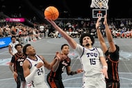 TCU forward David Punch (15) shoots during the second half of an NCAA college basketball...