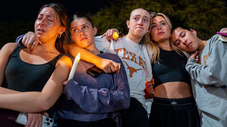 Students gather for a candlelight vigil for the victims of Sunday's mass shooting