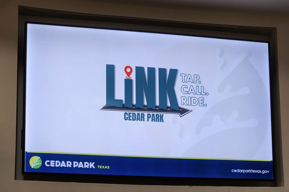 Director of Communications and Engagement Fran Irwin unveiled the logo for Cedar Park's on-demand rides program at a Feb. 26 City Council meeting. (Daniel Schwalm/Community Impact)