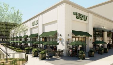 Architectural rendering of a corner spot in a strip center featuring The Henry signage and green awnings over multiple windows featuring outdoor seating areas.