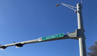 a road sign for McDermott Drive