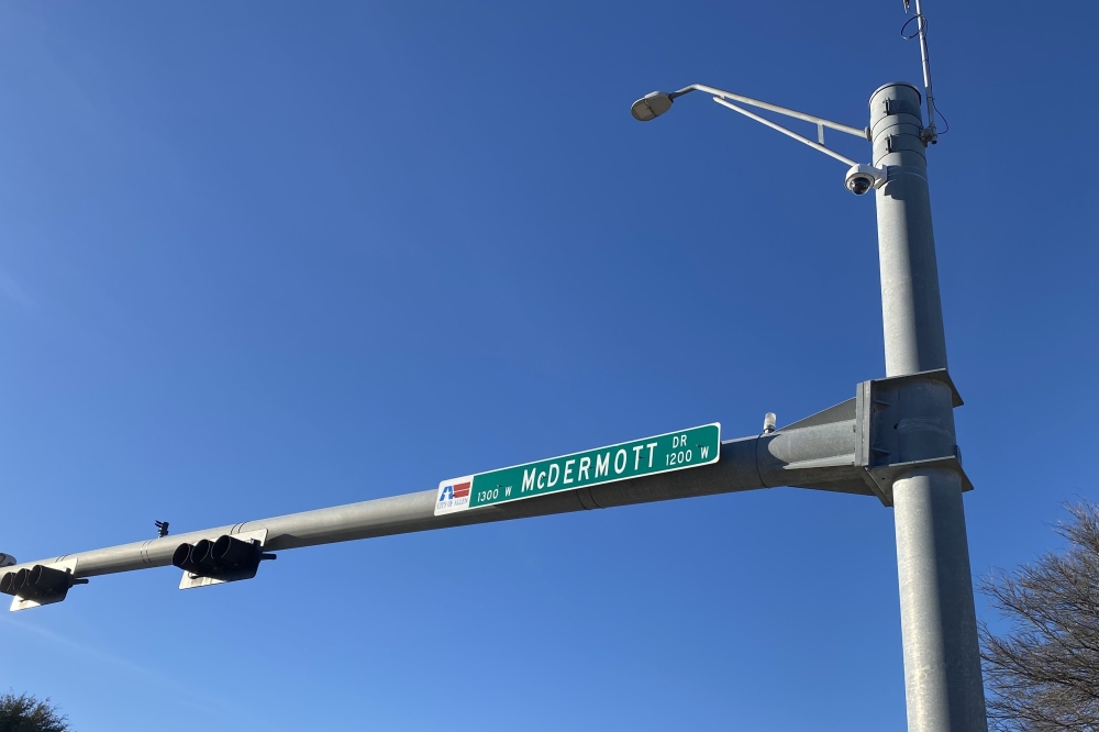 a road sign for McDermott Drive