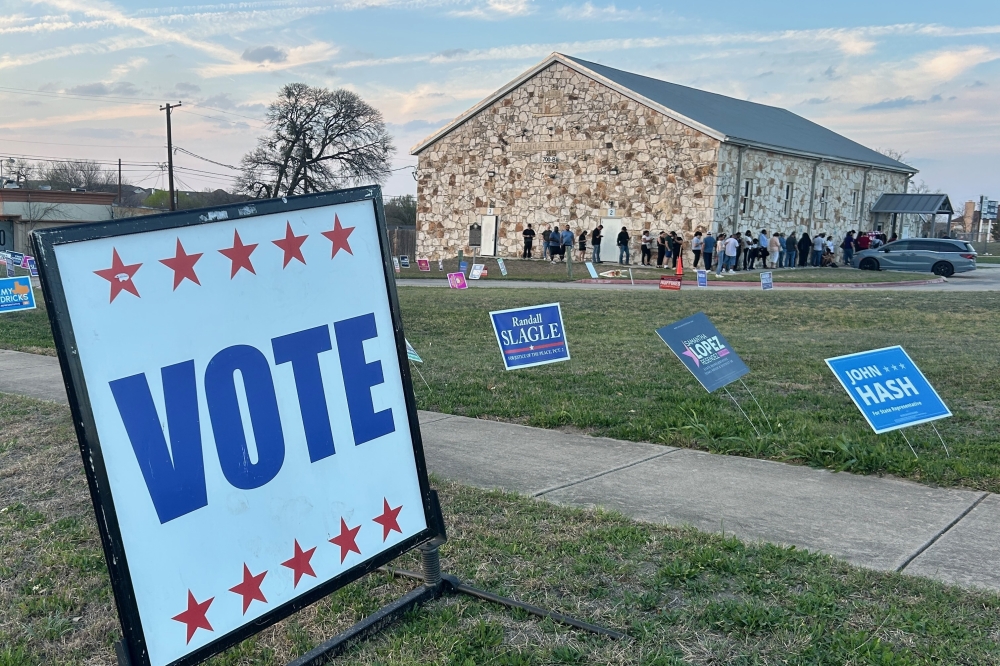 Voters queue outside of the PACE Gym in Pflugerville an hour before polls close on election day in Pflugerville. (Brooke Sjoberg/Community Impact)