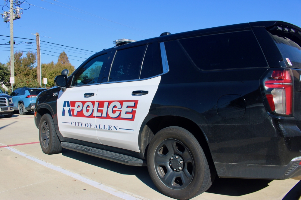 an Allen police car outside on a sunny day