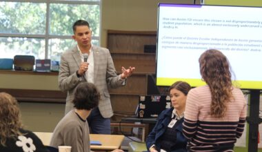 The superintendent speaks to parents at a meeting