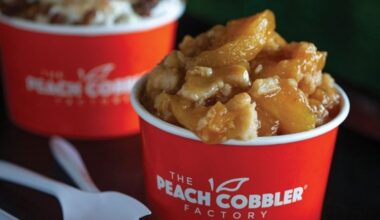 Two cups featuring The Peach Cobbler Factory branding filled with different desserts.