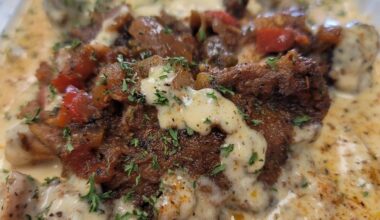 Meat in a cream sauce topped with herbs