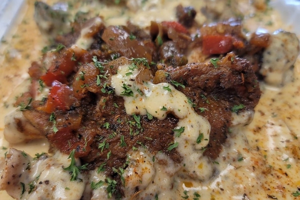 Meat in a cream sauce topped with herbs