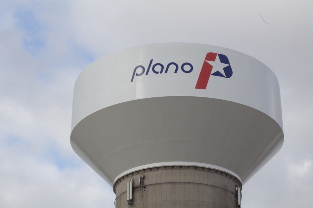 A water tower with the city of Plano logo