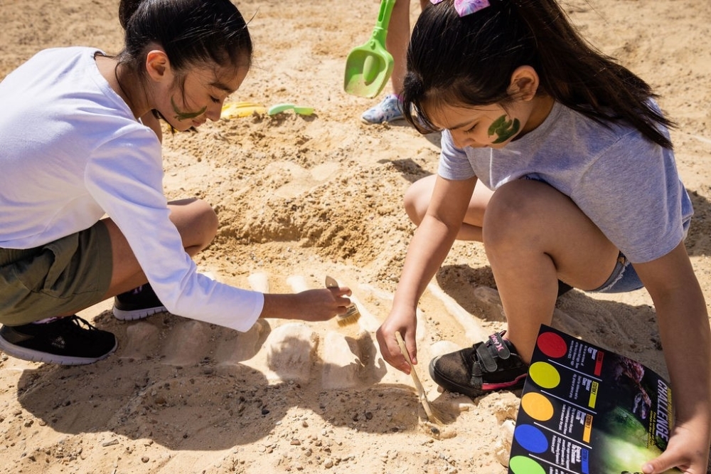 Girls looking for fossils in the dig pits