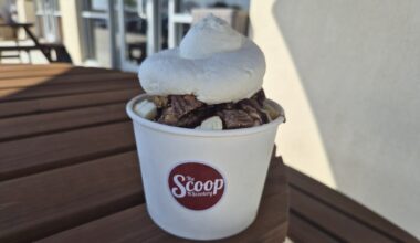 The Banana Hammock at The Scoop N Scootery comes with salty caramel topped with fresh banana slices, chocolate syrup and homemade whipped cream. (Patricia Ortiz/Community Impact)