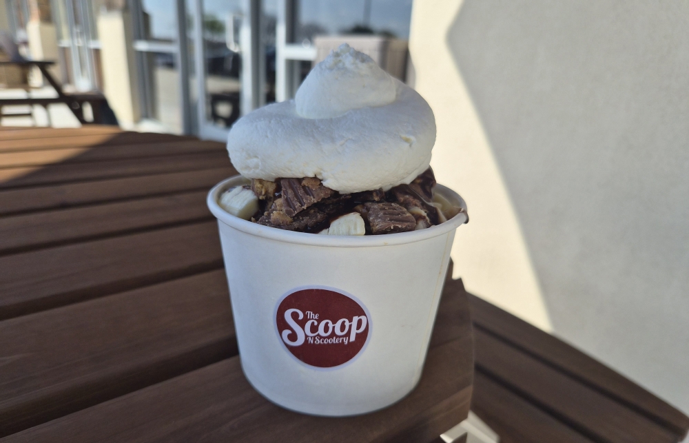 The Banana Hammock at The Scoop N Scootery comes with salty caramel topped with fresh banana slices, chocolate syrup and homemade whipped cream. (Patricia Ortiz/Community Impact)