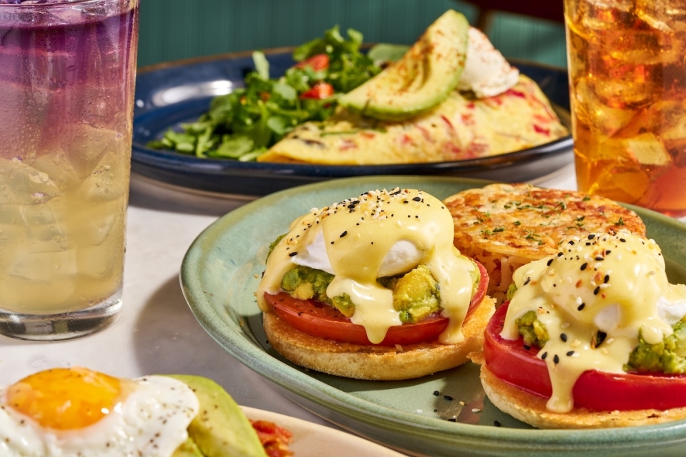 Snooze serves several eggs Benedicts, including the Smashed Avocado Benny pictured above. (Courtesy Snooze)