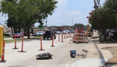 Cars driving between cones on Custer Road