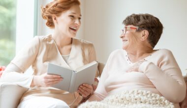 staff member reading to resident