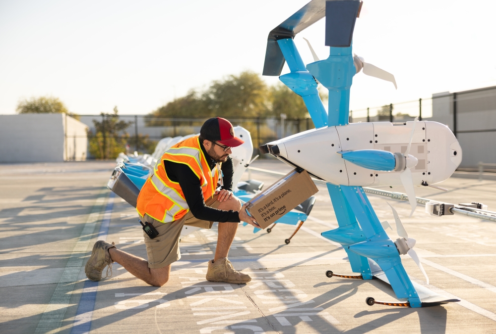 a photo of a man working on a drone