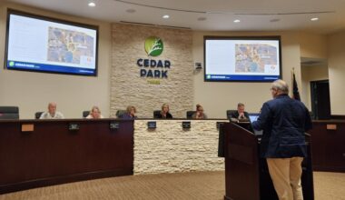 Cedar Park Planning Manager Dustin Henry speaks to the Planning and Zoning Commission about a rezoning request for the Indigo Ridge South development at its March 11 meeting. (Daniel Schwalm/Community Impact)