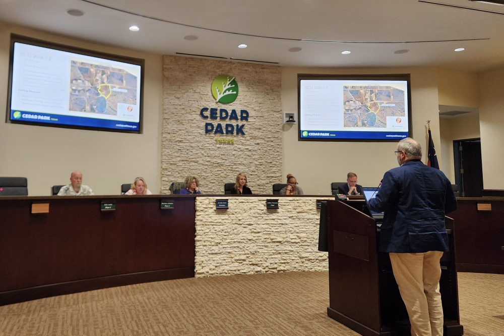 Cedar Park Planning Manager Dustin Henry speaks to the Planning and Zoning Commission about a rezoning request for the Indigo Ridge South development at its March 11 meeting. (Daniel Schwalm/Community Impact)