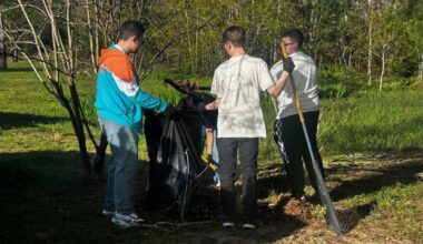 Lake Houston Outreach students picking up trash outside
