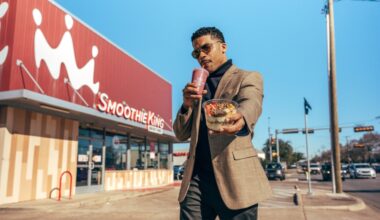 Man with smoothie and yogurt bowl