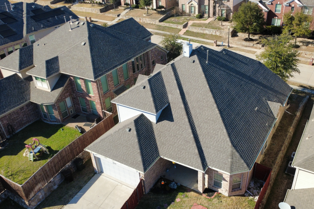 Titan GC team performing roof replacement and home restoration after storm damage, offering insurance advocacy and quality craftsmanship.