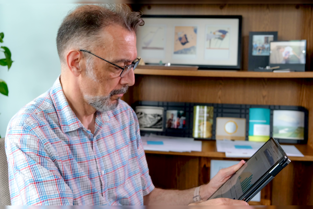 man looking at customer portal