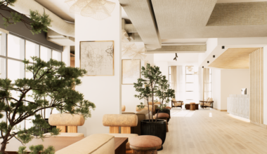 A rendering of a hotel lobby with cream walls, light wood floors and several plants