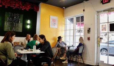 Customers eat and drink within Temple Coffee in The Village.