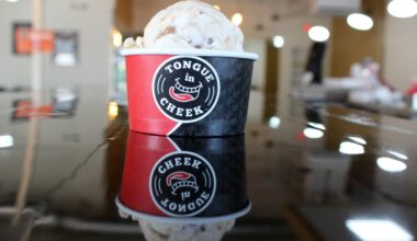 Ice cream in a cup featuring Tongue in Cheek branding.