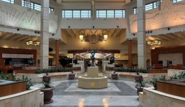 An empty lobby in Willow Bend mall with marble flooring