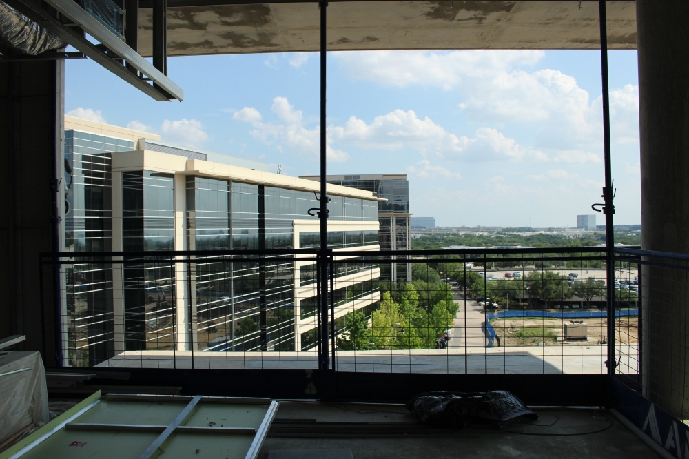 Construction at Hall Park in Frisco will lead to a new multifamily facility on top of a parking garage. (Community Impact staff)