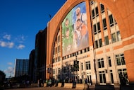 Fans line up outside the doors of American Airlines Center before the start of an NHL hockey...