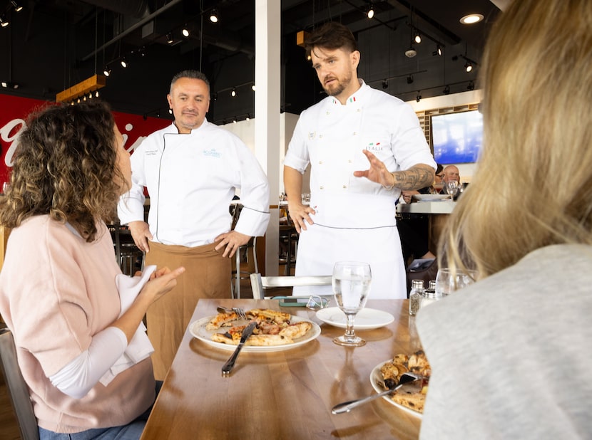 Chefs Fredi Plaku (left) and Gimmy Piperku (right) chat with diners at Acquario Pizza Pasta...