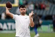Philadelphia Eagles quarterback Sam Howell throws during pre-game warm-ups before an NFL...