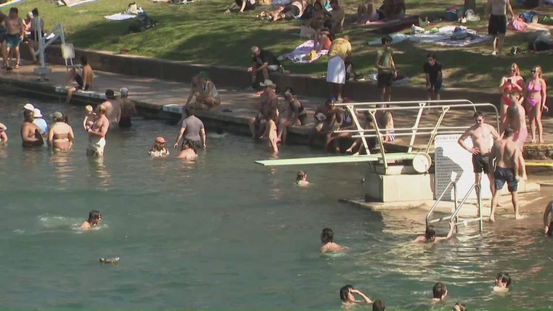 Barton Springs Pool reopens after construction delay, draws large crowds amid record heat