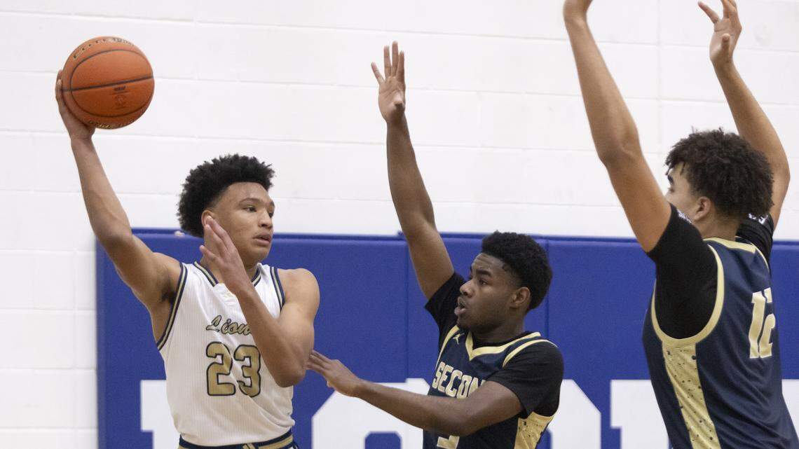 Arlington Grace Prep’s MJ Boyd (left) looks for an opening against Houston Second Baptist in the TAPPS Class 5A state championship game Saturday at Robinson High School.