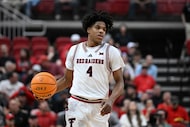 Texas Tech guard Christian Anderson (4) brings the ball up court against Cincinnati during...