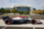 A Grand Prix of Arlington liveried IndyCar outside the AT&T Stadium