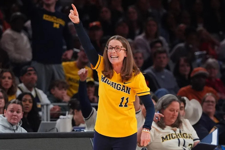 Michigan head coach Kim Barnes Arico reacts to play against Louisville in the first half in the Sweet 16 of the NCAA college basketball tournament, Saturday, March 28, 2026, in Fort Worth, Texas. (AP Photo/LM Otero)